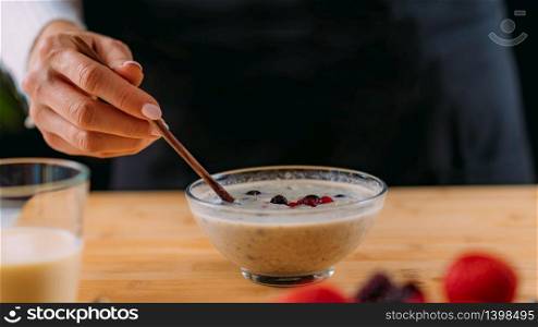 Superfoods - Making oatmeal with Oats, Soy Milk and Berries