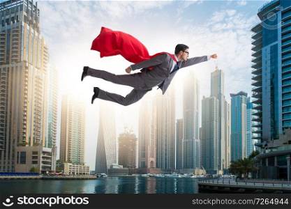 Superhero businessman flying over the city. The superhero businessman flying over the city