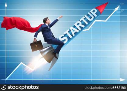 Superhero businessman in start-up concept flying rocket