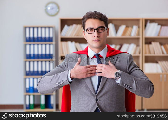 Superhero businessman working in the office