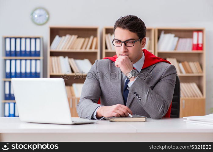 Superhero businessman working in the office