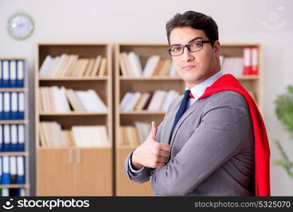 Superhero businessman working in the office