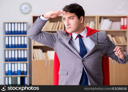 Superhero businessman working in the office