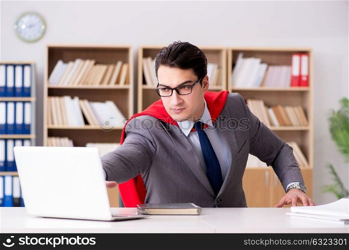 Superhero businessman working in the office
