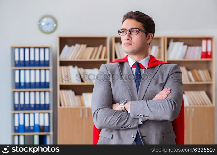 Superhero businessman working in the office