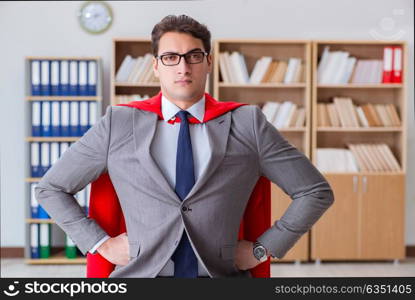 Superhero businessman working in the office