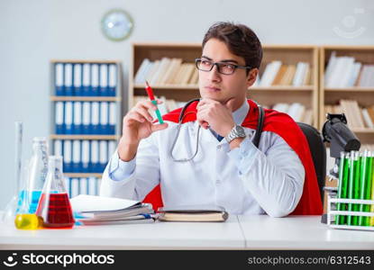 Superhero doctor working in the hospital lab