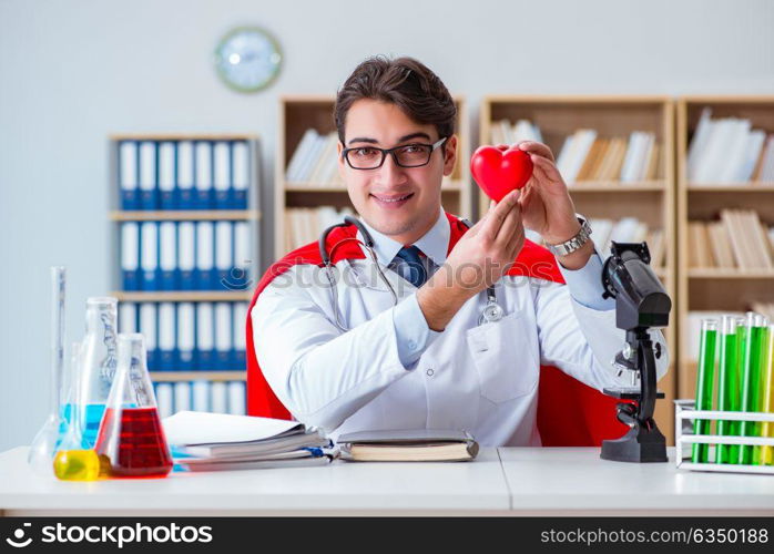 Superhero doctor working in the hospital lab