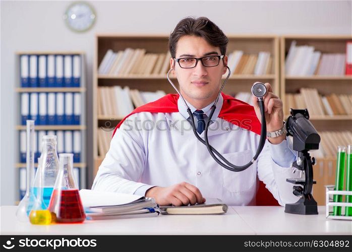 Superhero doctor working in the lab hospital