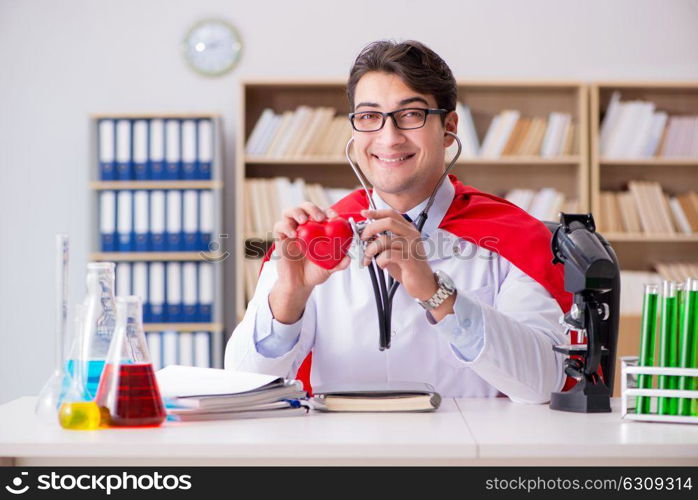 Superhero doctor working in the lab hospital