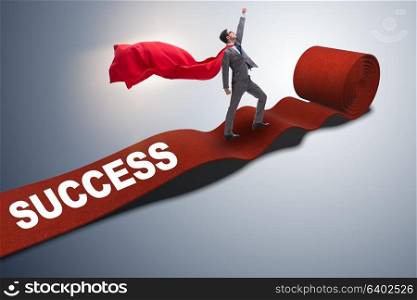 Superhero on the red carpet in success concept