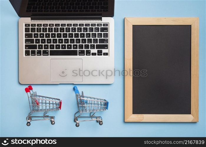 supermarket carts near laptop frame