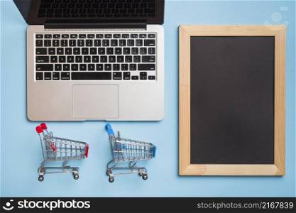 supermarket carts near laptop frame