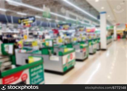 Supermarket store blur background ,Cashier counter with customer