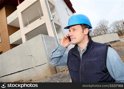 Supervisor talking on the phone on construction site