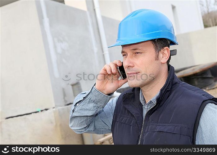 Supervisor talking on the phone on construction site
