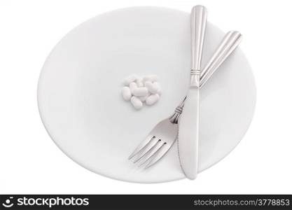 Supplement pills on plate on white background