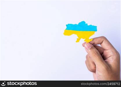 Support for Ukraine in the war with Russia, Hands holding the shape of Ukraine border with color flag. Pray, No war, stop war and stand with Ukraine