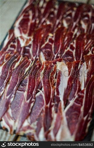 Supreme quality Spanish Iberian ham portion in a luxury European restaurant