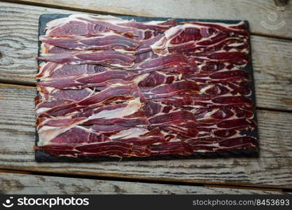 Supreme quality Spanish Iberian ham portion in a luxury European restaurant
