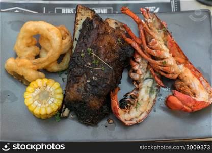 Surf and Turf, grilled canadian lobster and grilled beef ribs