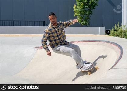 Surf skater performing a turn on a skatepark during a sunny day.