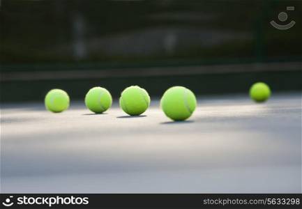 Surface level shot of tennis balls lying on ground