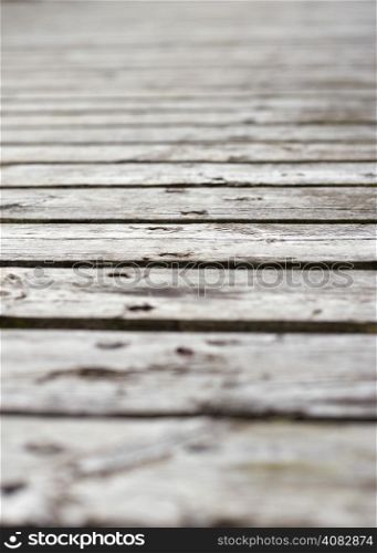 Surface of old plank pier, gray sunburnt - copy space