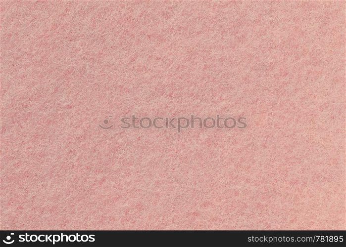 Surface of rose-colored felt close-up. Pink background, seamless texture.