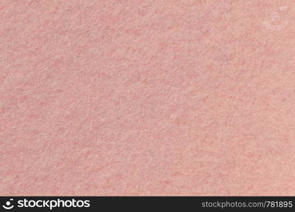 Surface of rose-colored felt close-up. Pink background, seamless texture.