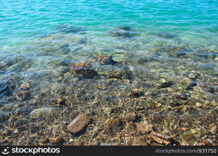 Surface of sea with different shades of blue. Clear water in the Red Sea. Different shades of blue. Blue sea with shades of turquoise, azure, emerald colors. Colorful ocean surface. Blue sea with shades of turquoise, azure, emerald colors. Colorful ocean surface