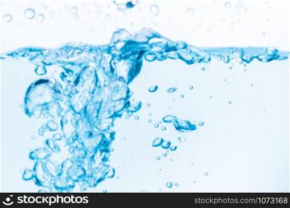 Surface of the blue water waves splash on a white background