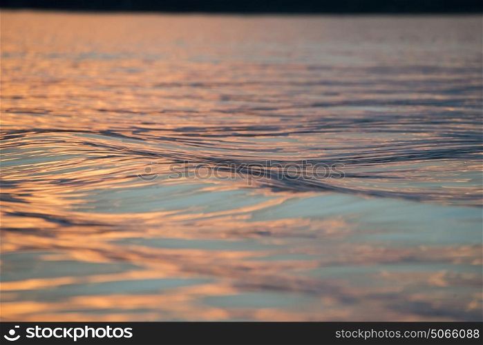 Surface of the water on the Lake at dusk, Lake of The Woods, Ontario, Canada
