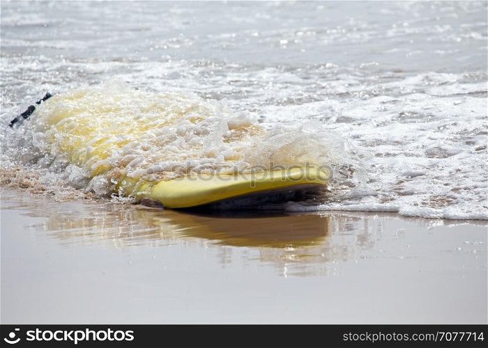 Surfboard floating in the atlantic ocean