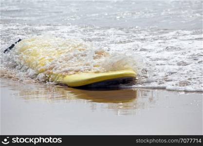 Surfboard floating in the atlantic ocean