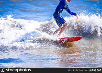 surfer dude on a surfboard riding ocean wave