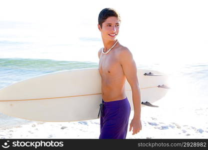 Surfer handsome boy teenager with surfboard in beach shore