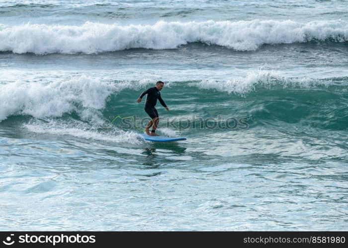 Surfer in action at sunset. Furadouro beach, Ovar - Portugal.