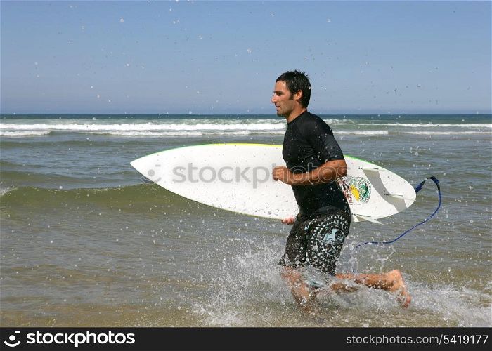 surfer in profile running