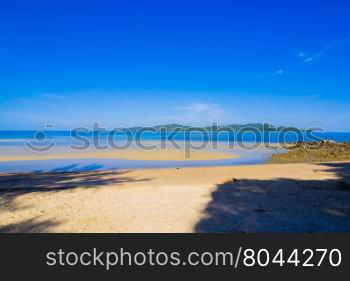 Surfer on Pretty beach and ocean with blue sky