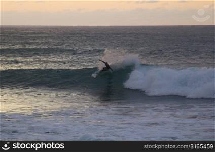 Surfer Riding Wave