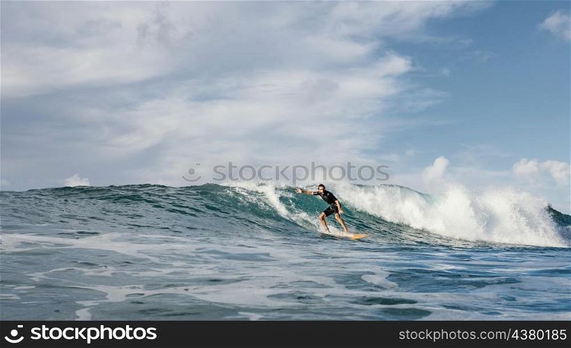surfer riding wave daylight