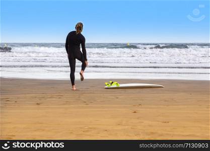 surfer warming up on the beach Tenerife island,Spain
