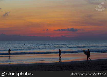 Surfer Watching the Waves at Sunset.