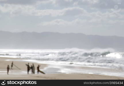 Surfers on Beach in Mist