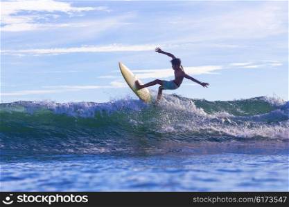 Surfing a wave, Bali, Indonesia.model released