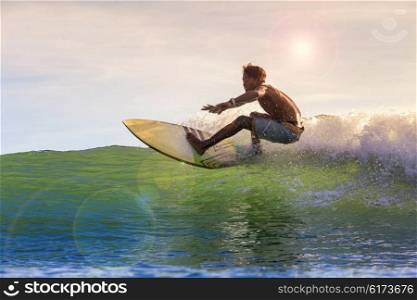Surfing a wave, Bali, Indonesia.model released