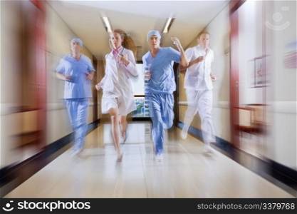 Surgeon and nurse running in hallway of hospital