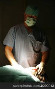 Surgeon examining patients head