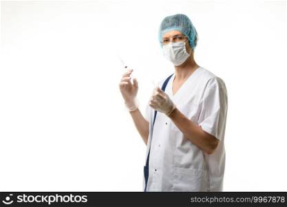 Surgeon holds a syringe in his hands and looked into the frame, isolated on white background